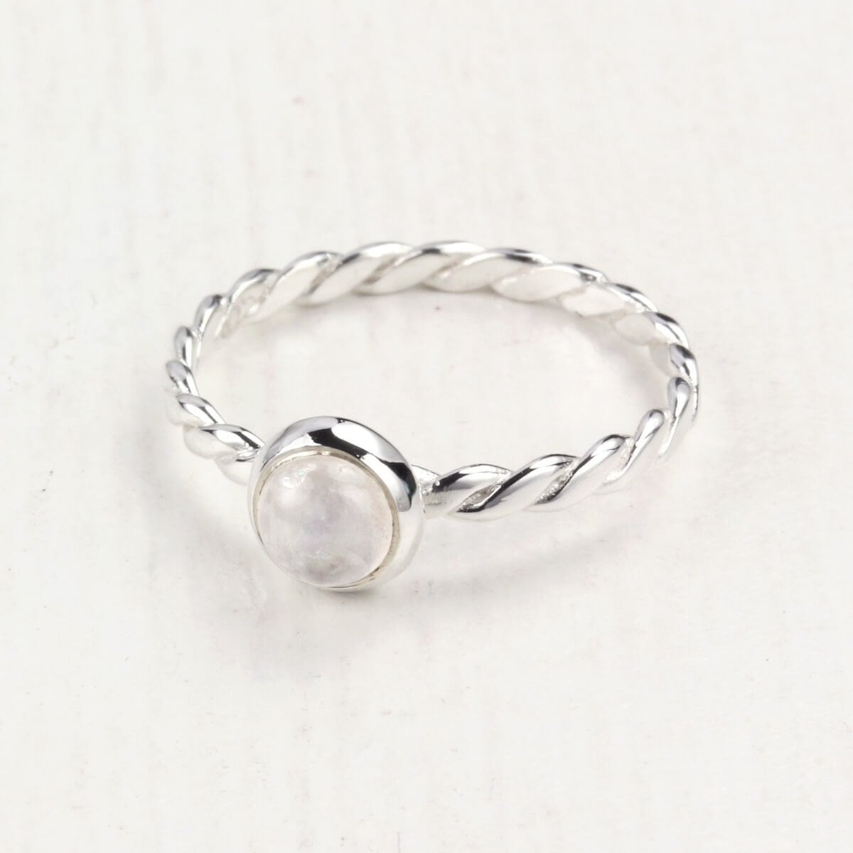 June Birthstone Ring with Moonstone on table